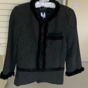 Designer jacket in black and grey tweed.
Detail fringe